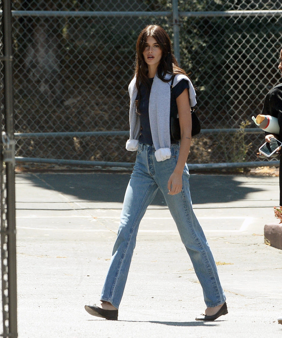 Kaia Gerber wearing ballet flats, the style of ballerina shoes that fashion editors are choosing as their go-to summer shoes this season.
