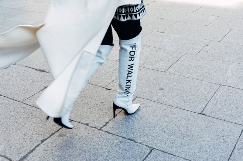 Hailey Bieber shoes captured in a street style look, featuring sleek designer footwear paired with a minimalist, fashion-forward outfit