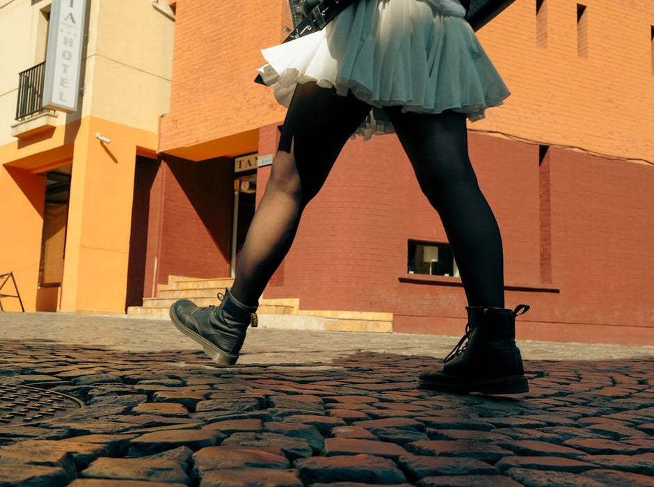 Stylish women's flats on cobblestone streets — among the best vacation shoes for Europe travel