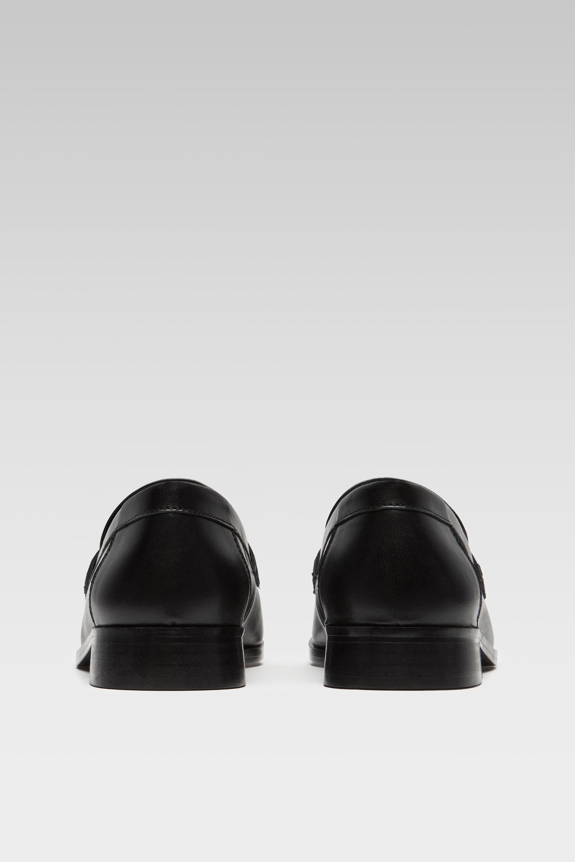 Back view of EDLA Earth black loafers for women crafted from leather.