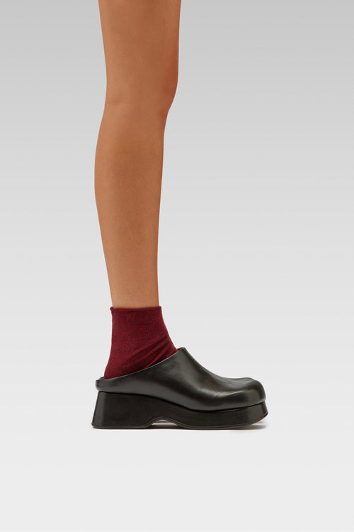 EDLA Ursa burgundy socks with EDLA Venus black mules for women crafted from leather with a platform heel.