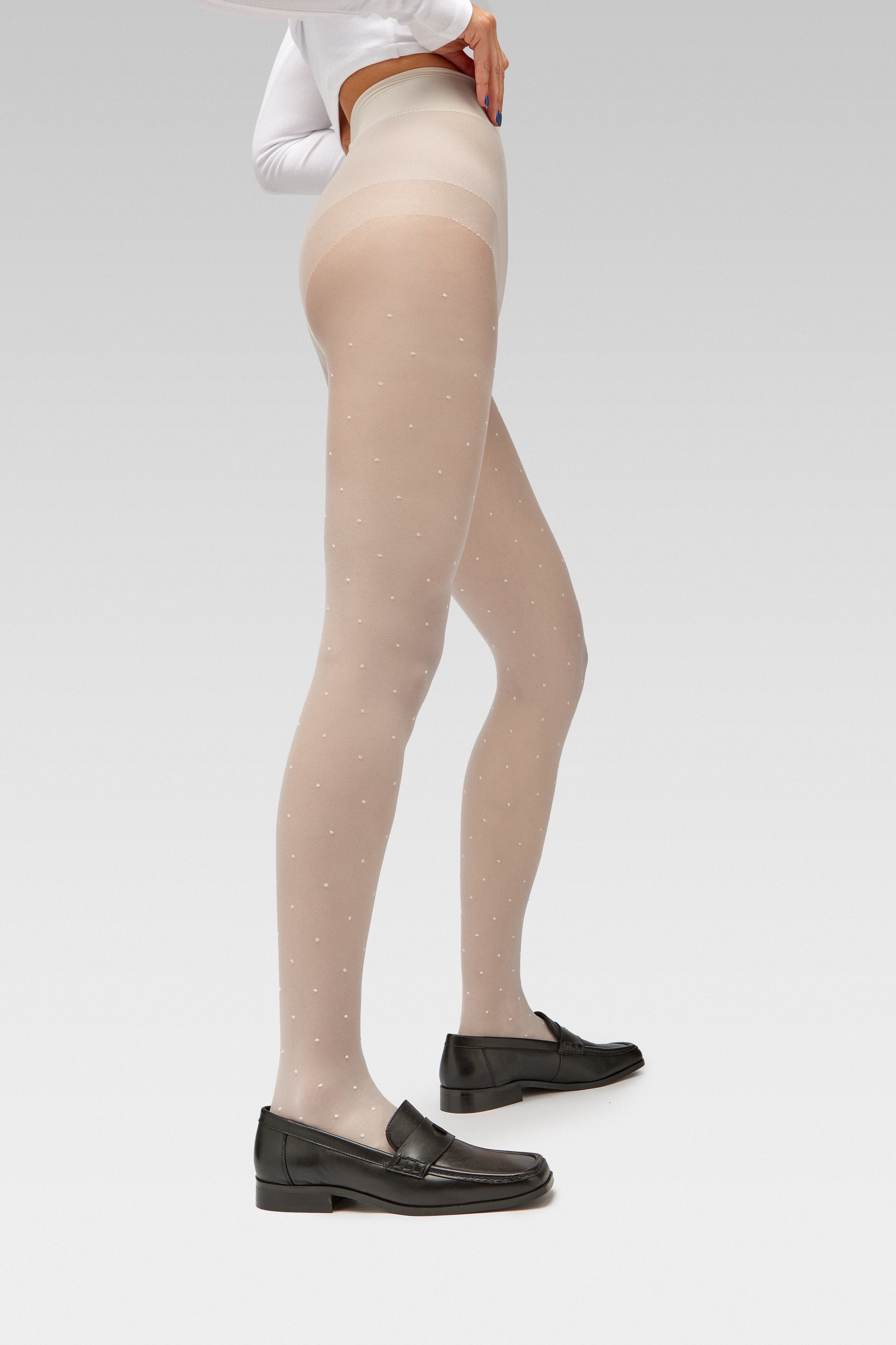 EDLA Orbit White Polka Dots tights Crafted from a 20 denier eco-friendly yarn, the Orbit Tights feature an all-over polka dot pattern, a sheer body, and a bikini brief cut with EDLA black Earth loafer Crafted from soft nappa lambskin, the Earth Loafer features a squared toe and a cut-out band with moon and star details. 