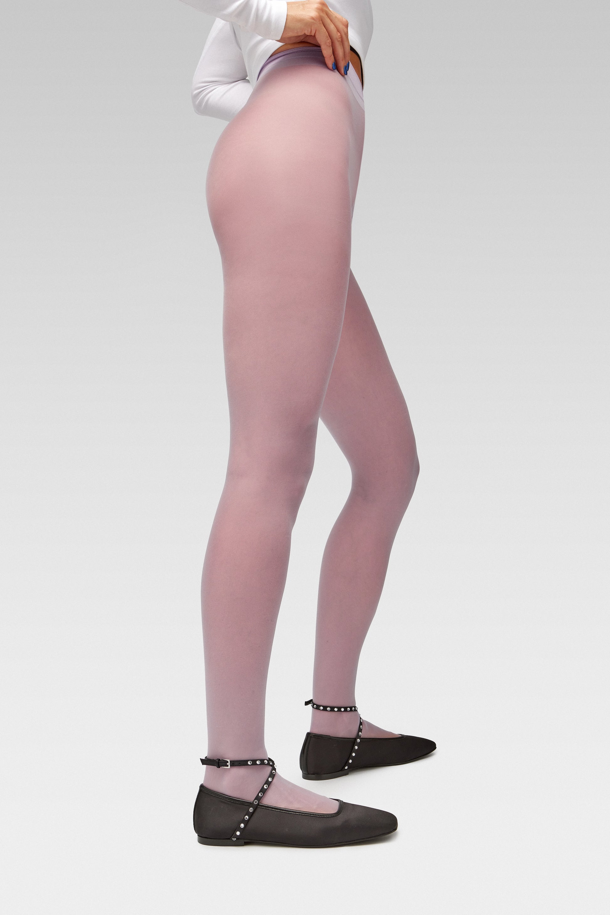 Galaxy Lilac tights Crafted from a silky 20 denier finish, the Galaxy Tights feature a sheer body, shaped silhouette, and invisible toe with EDLA Saturn Ballet black flats Crafted from satin, the Saturn Ballet Flat features crystal-embellished straps and a squared toe. 