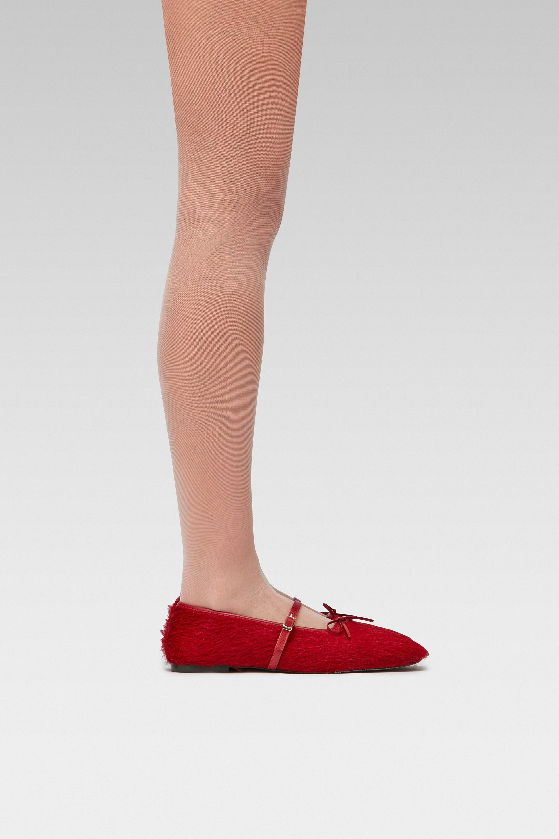 EDLA Galaxy Blush tights Crafted from a silky 20 denier finish, the Galaxy Tights feature a sheer body, shaped silhouette, and invisible toe with EDLA Mars Burgundy Ballet Flat Crafted from hair calf, the Mars Ballet Flat features a front strap, bow detail, and a squared toe. 