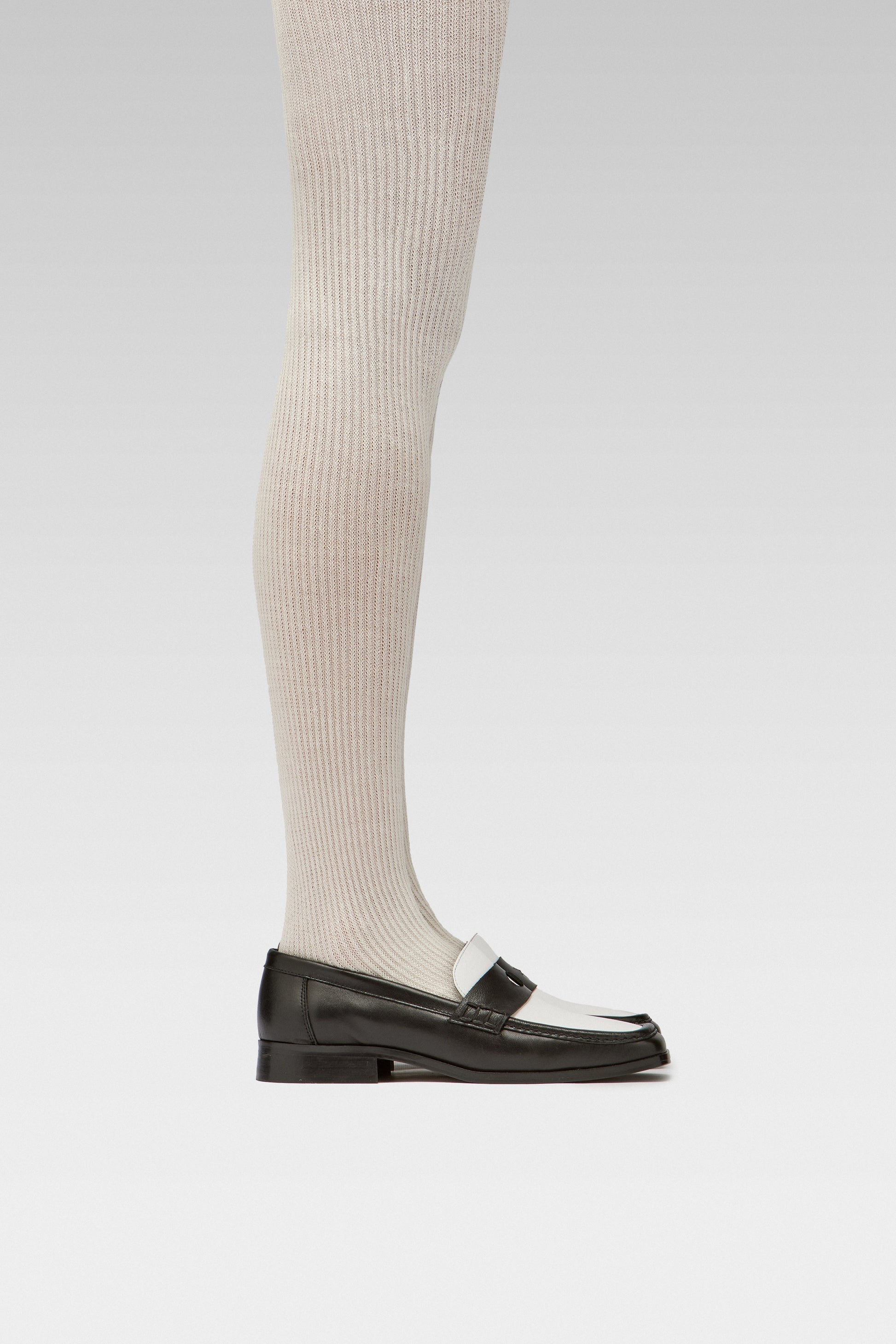 EDLA cosmo ribbed white tights with EDLA earth black and white loafers.