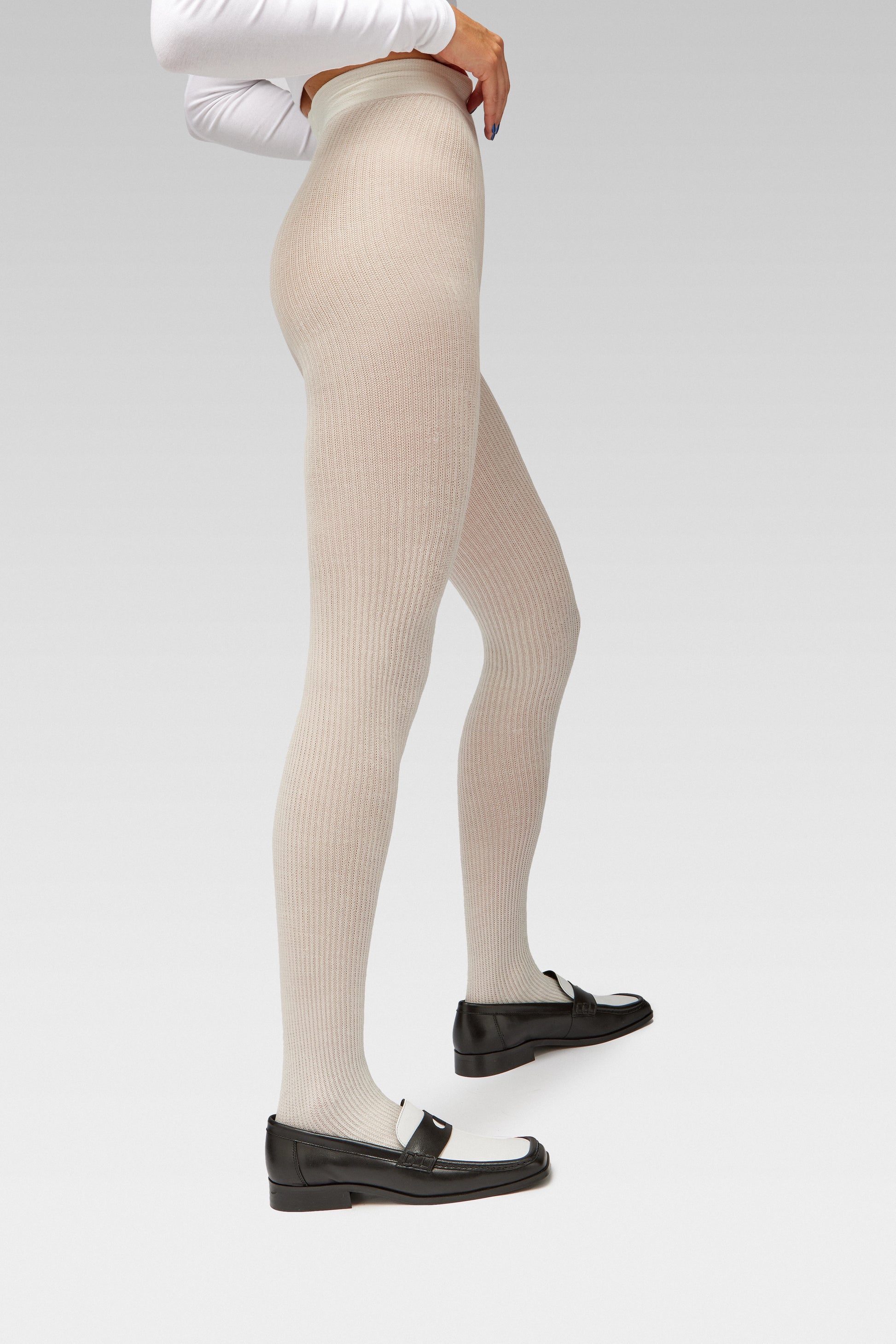 EDLA cosmo ribbed white tights with EDLA earth black and white loafers.