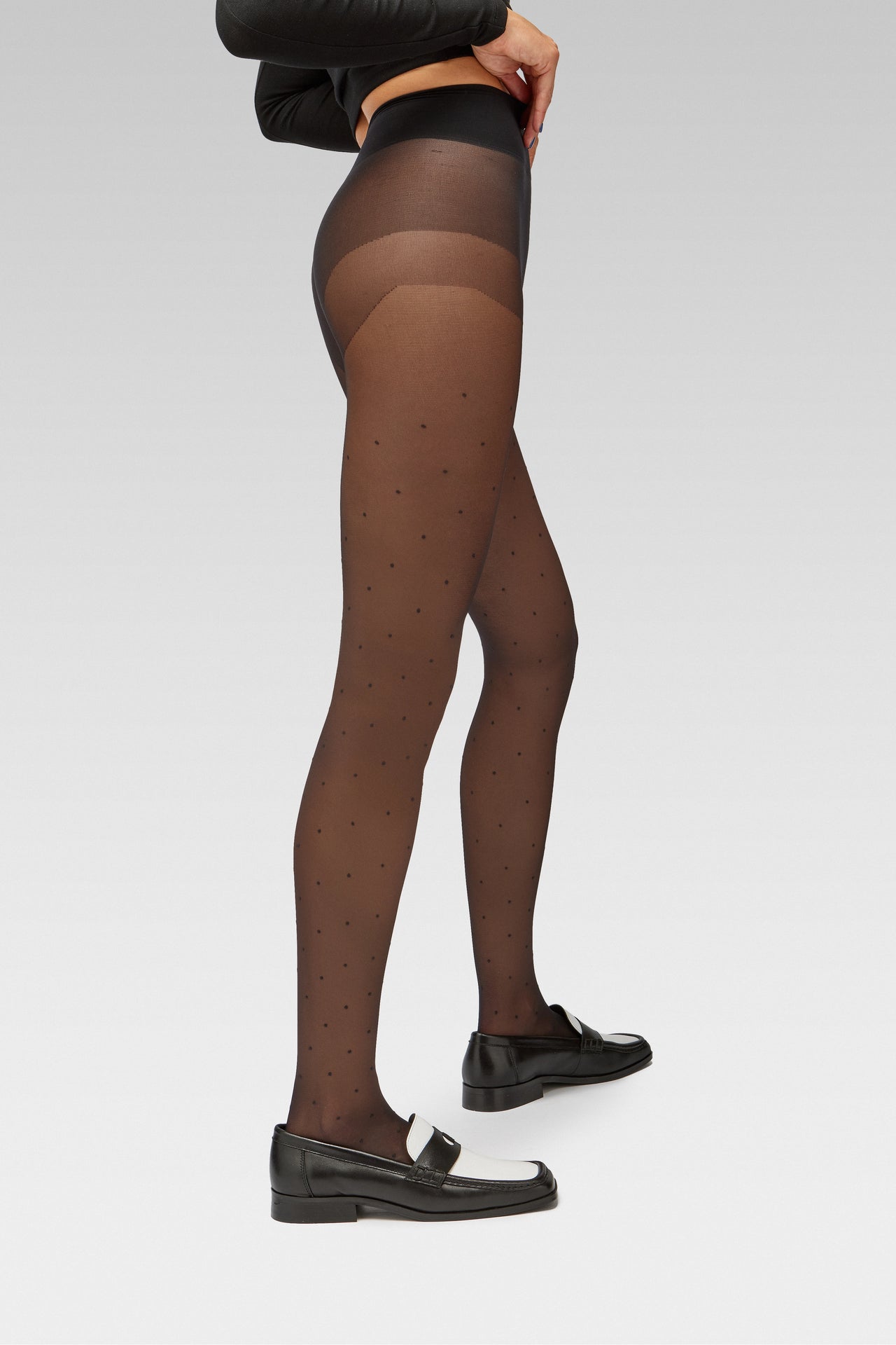 EDLA Orbit Black Polka Dots tights Crafted from a 20 denier eco-friendly yarn, the Orbit Tights feature an all-over polka dot pattern, a sheer body, and a bikini brief cut with EDLA black and white Earth loafer.