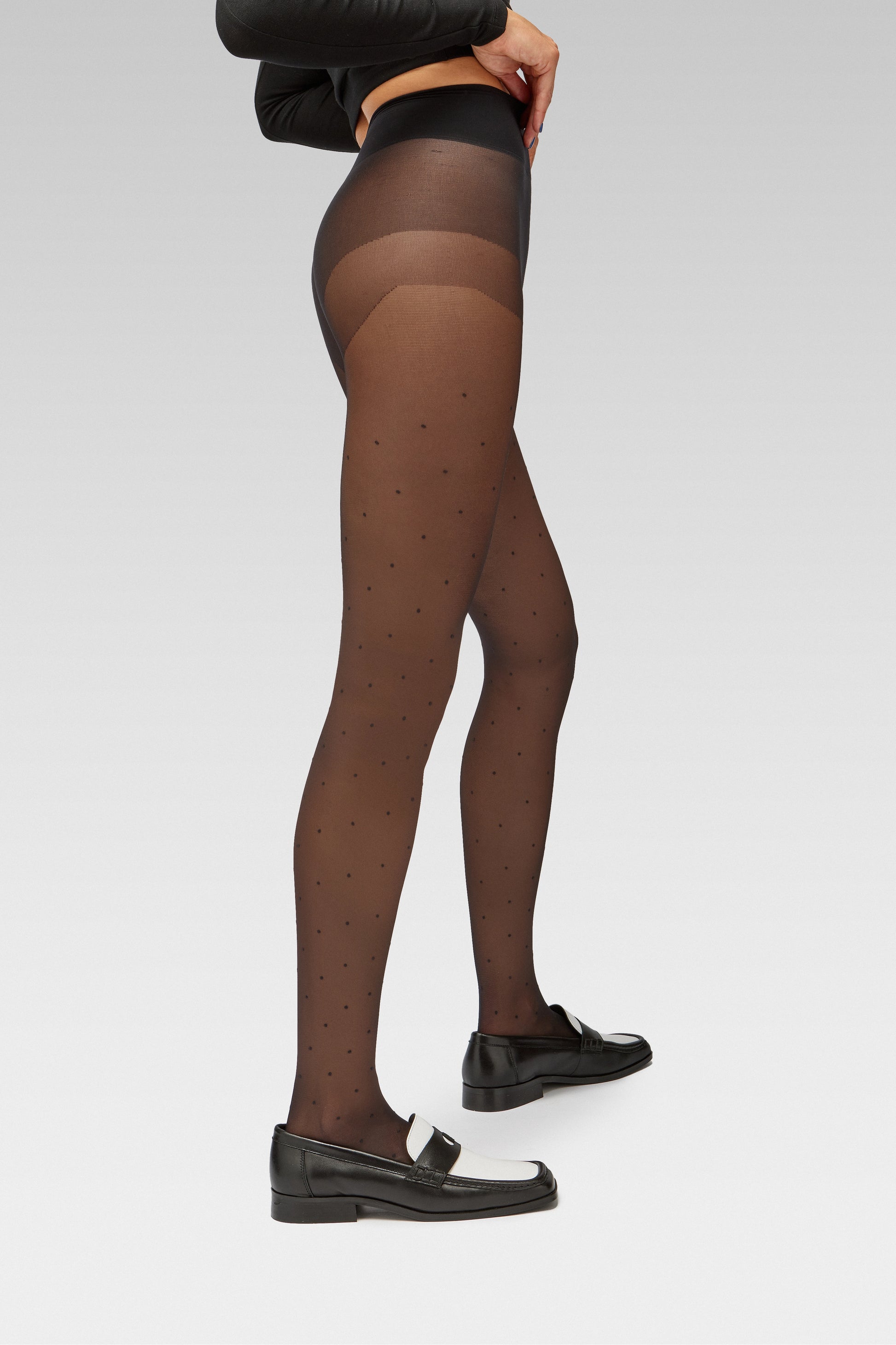 EDLA Orbit Black Polka Dots tights Crafted from a 20 denier eco-friendly yarn, the Orbit Tights feature an all-over polka dot pattern, a sheer body, and a bikini brief cut with EDLA black and white Earth loafer.