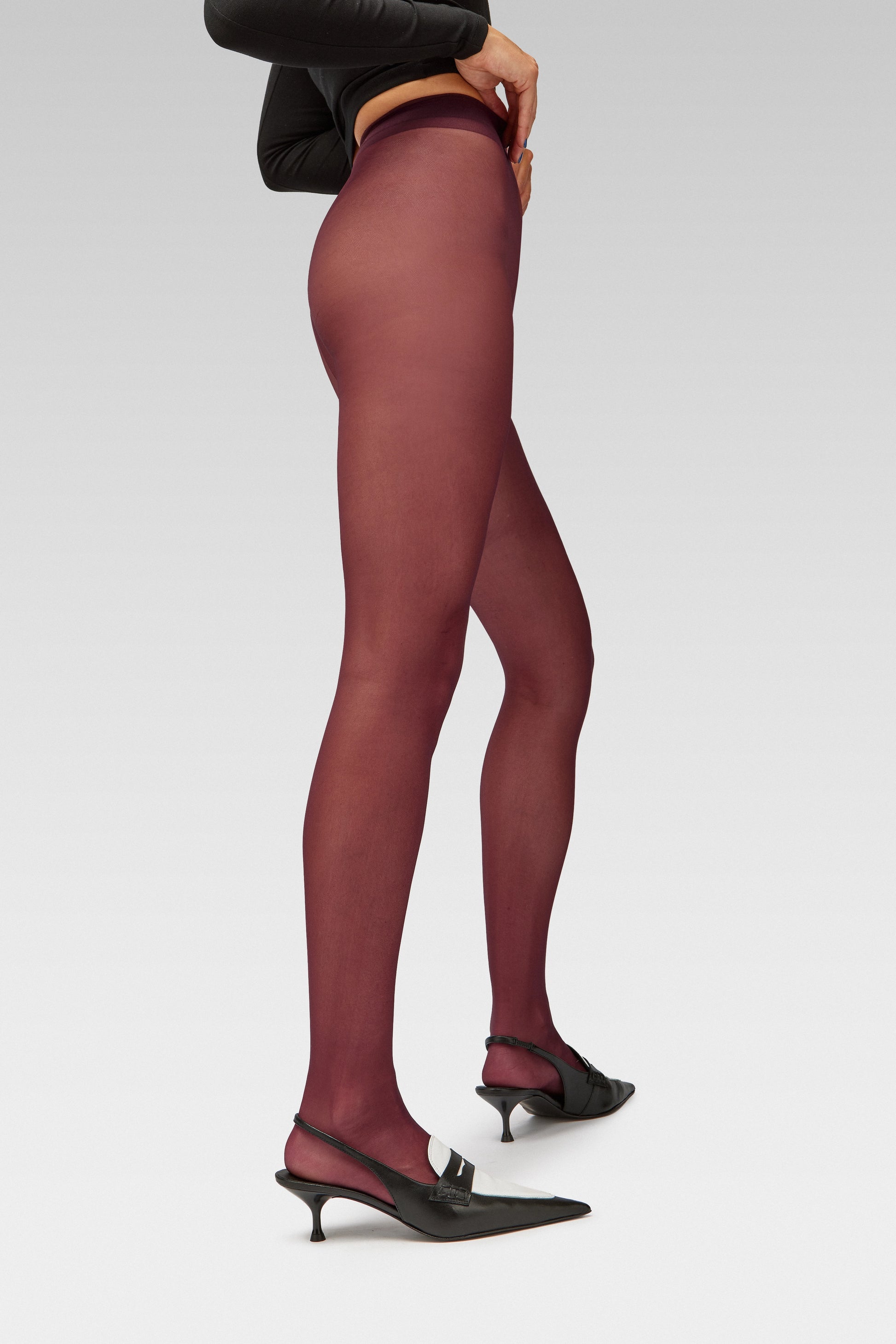 EDLA Galaxy Burgundy tights with EDLA Uranus Slingback black and white kitten heel Crafted in soft nappa lambskin, the Uranus Slingback features a pointed toe, penny loafer-inspired band, and a 5cm kitten heel. 