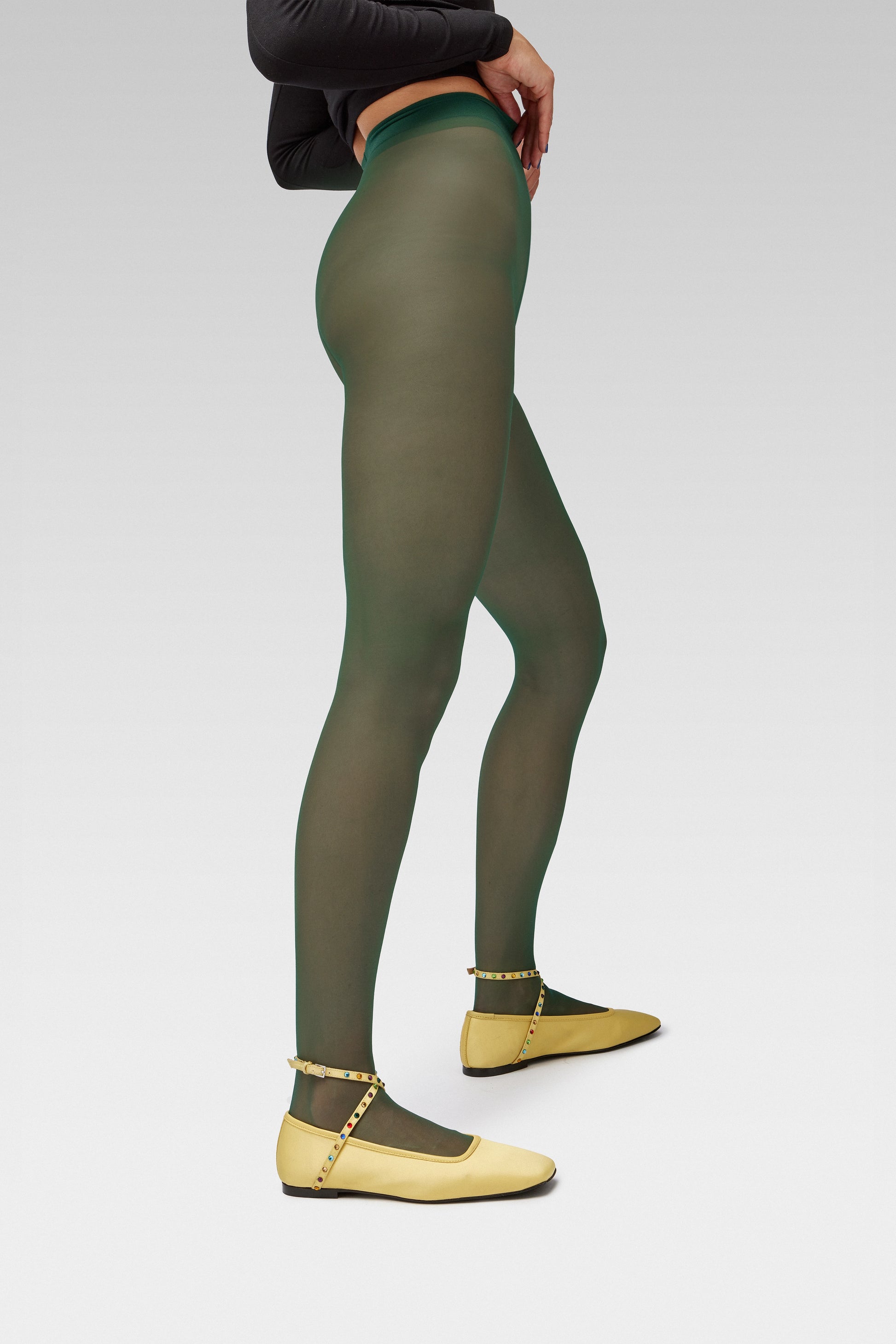 EDLA Galaxy green tights with EDLA Yellow Saturn ballet flats Crafted from butter yellow satin, the Saturn Ballet Flat features multicolored crystal-embellished straps and a squared toe.