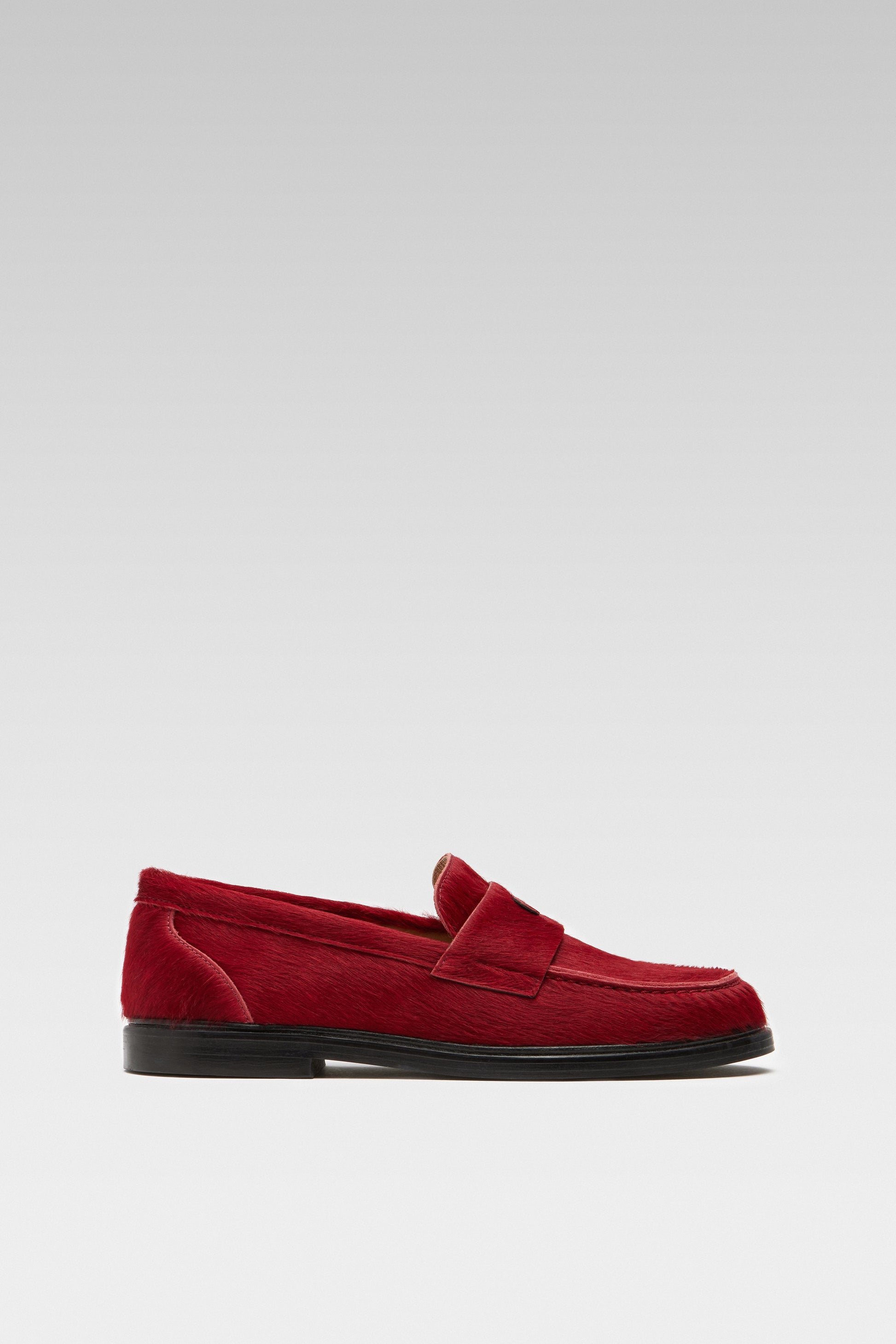 Side view of EDLA Jupiter red loafers for women crafted from calf hair.