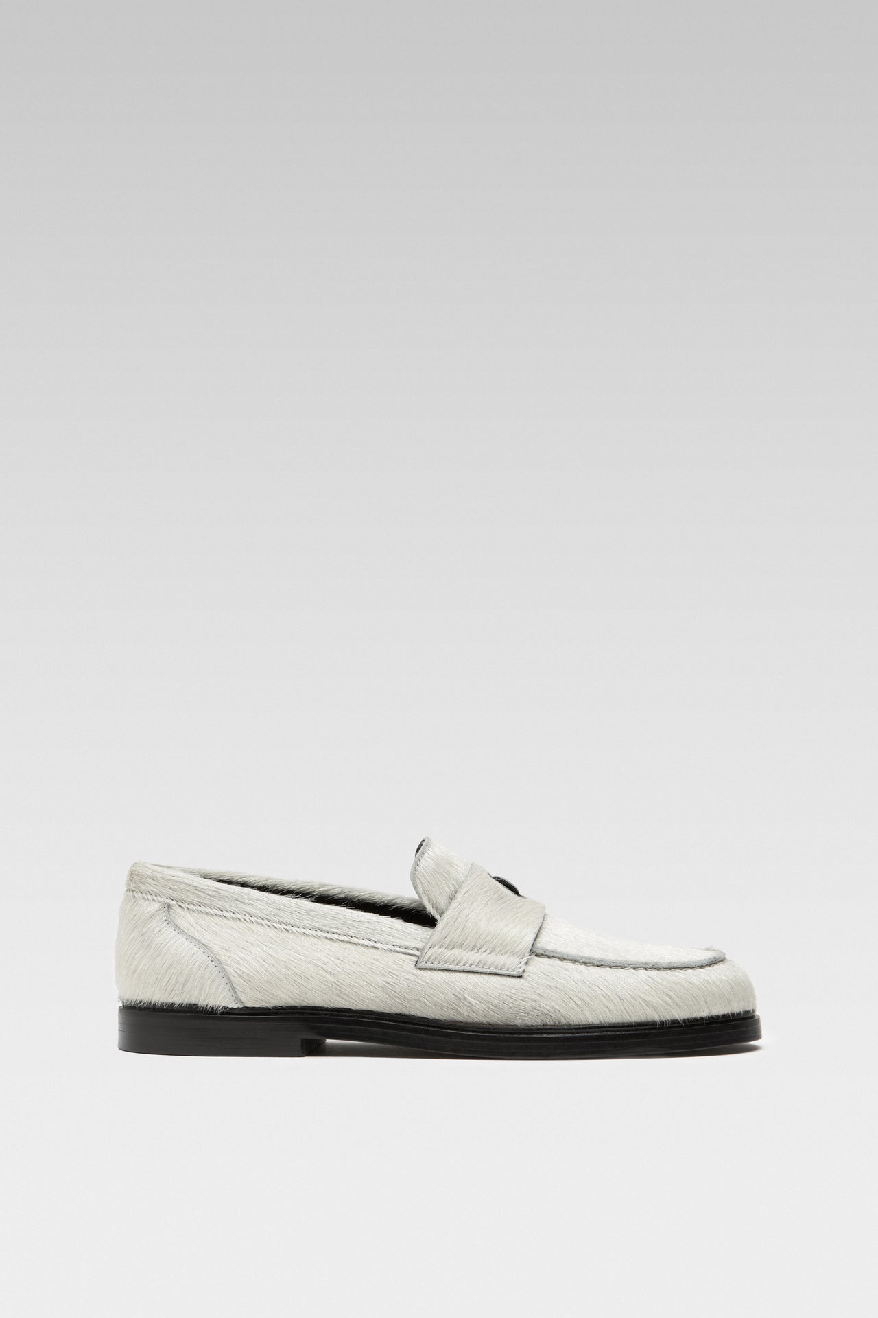 Side view of EDLA Jupiter white loafers for women crafted from calf hair.