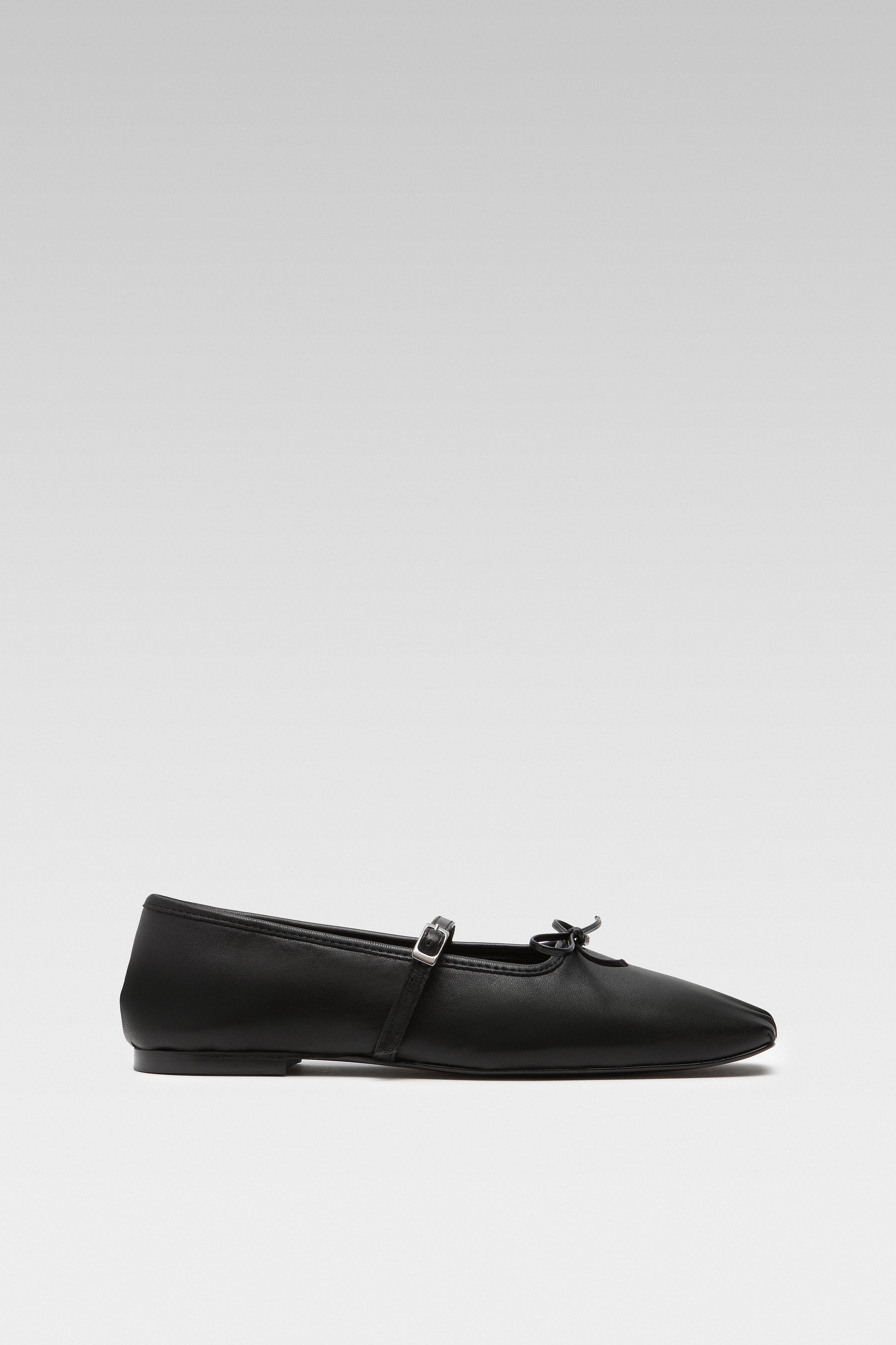 Side view of EDLA Mars black ballet flats crafted from leather.