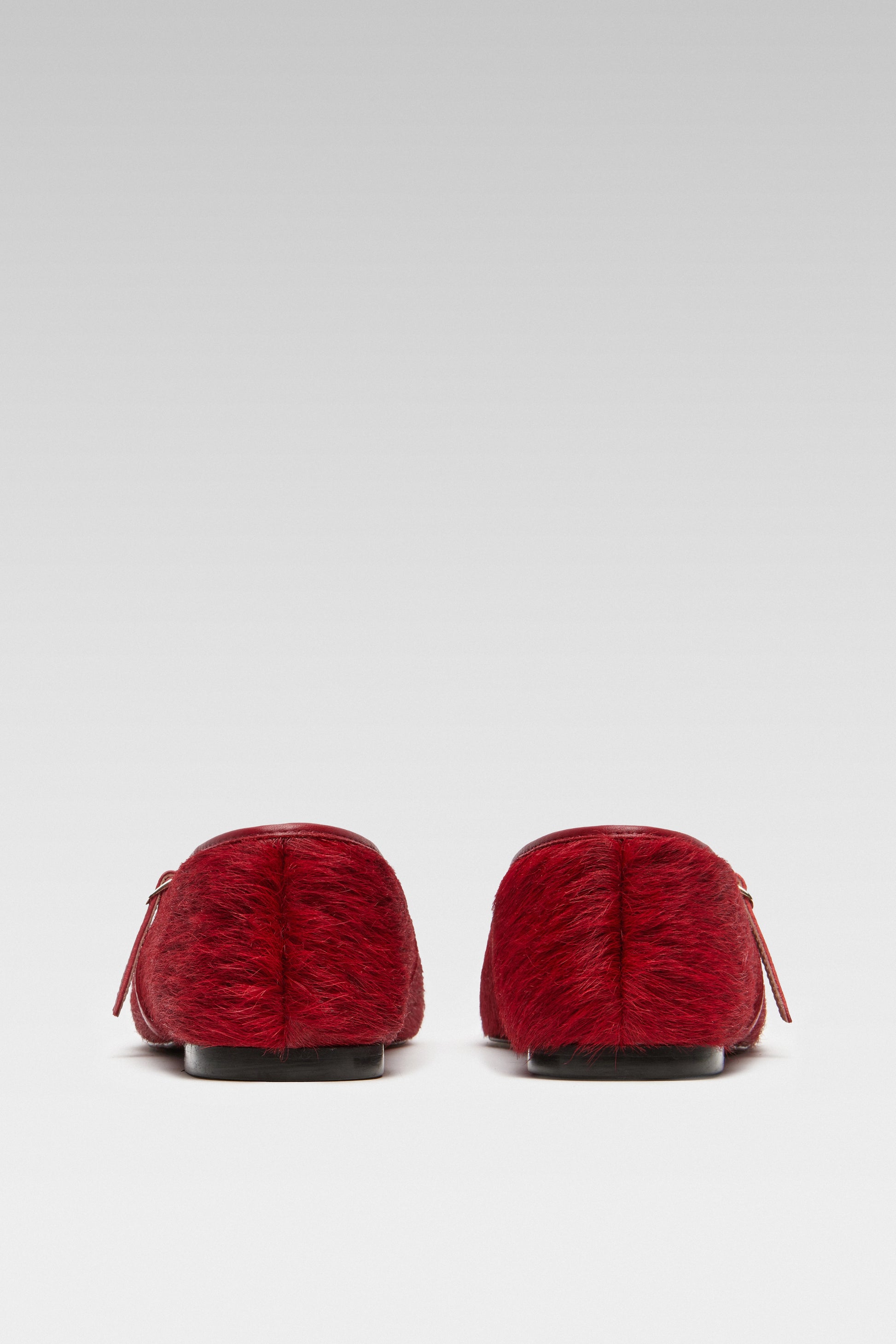 Back view of EDLA Mars red mary jane flats crafted from calf hair.