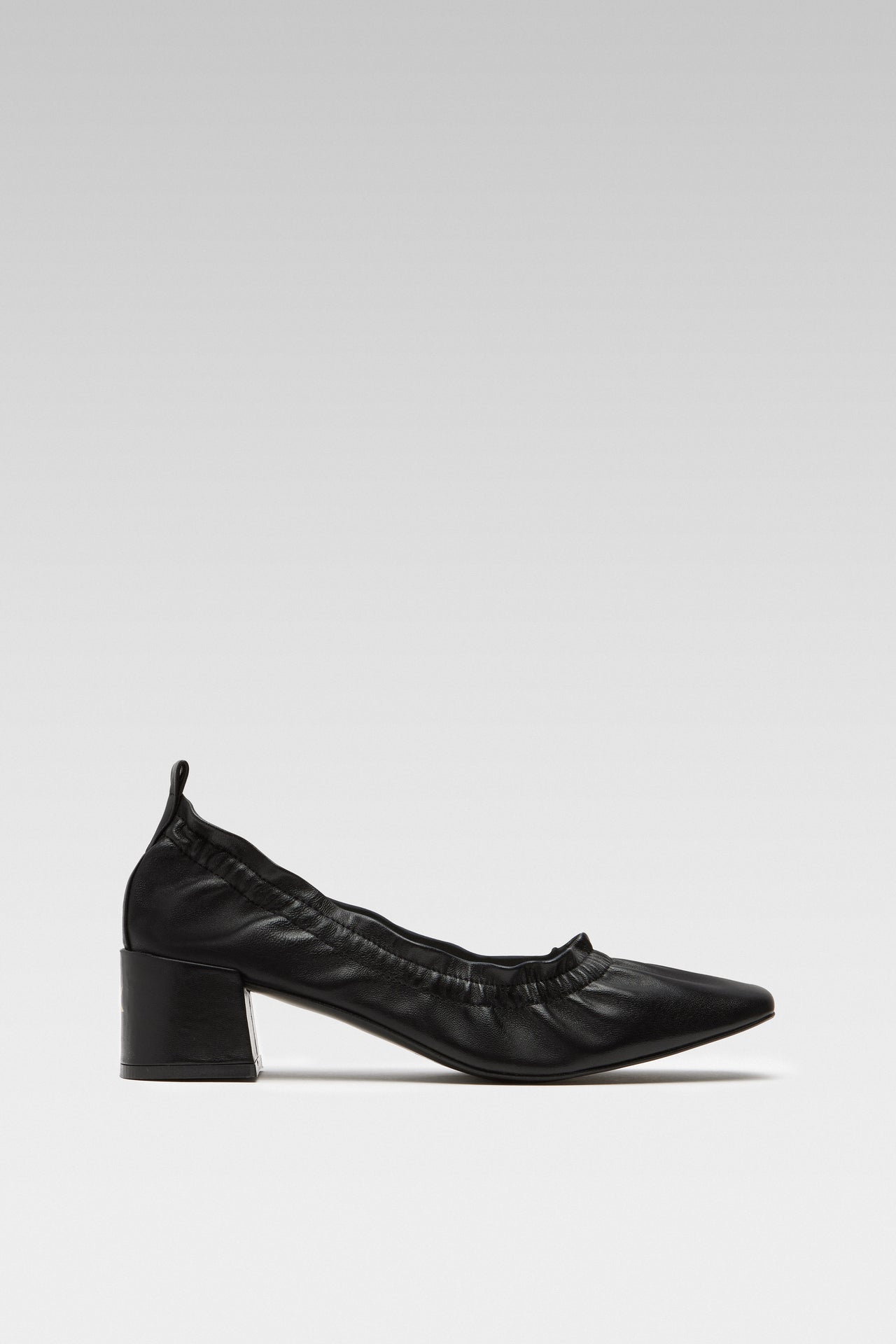 Side view of EDLA Mercury black kitten heels crafted from leather with a block heel and elastic ruched band.